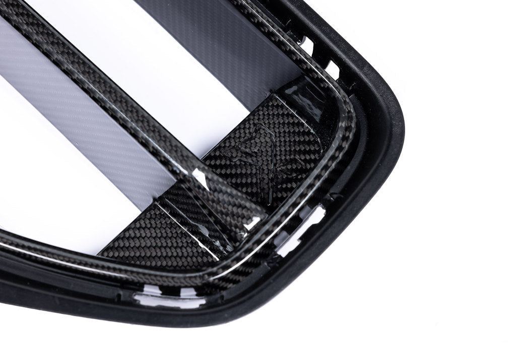Alpha N G87 M2 carbon front grille for BMW exterior, showcasing the sleek, lightweight carbon fiber design on a sports car.