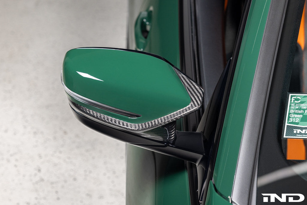 Alpha N G8X M2 M3 M4 carbon mirror cap set for exterior, showcasing sleek, black carbon fiber mirror covers on a vehicle.