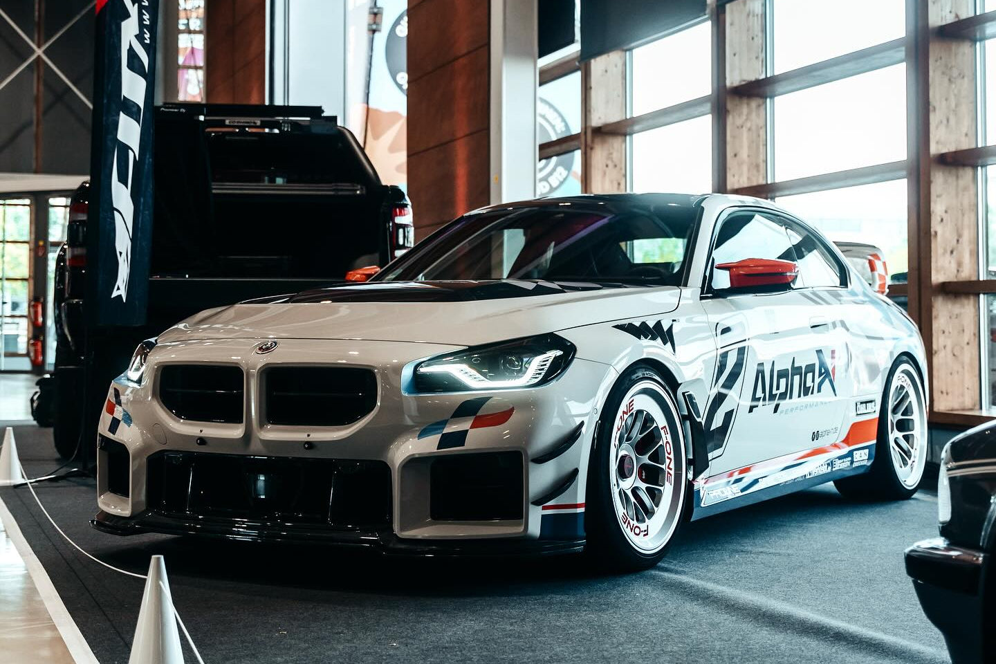 Alpha-N carbon bumper canard set installed on BMW G87 M2 front bumper