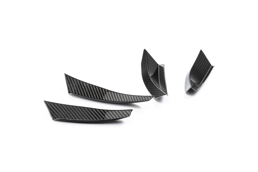 Alpha N G87 M2 carbon bumper canard set mounted on white background, enhancing the car's sporty exterior aerodynamic features.