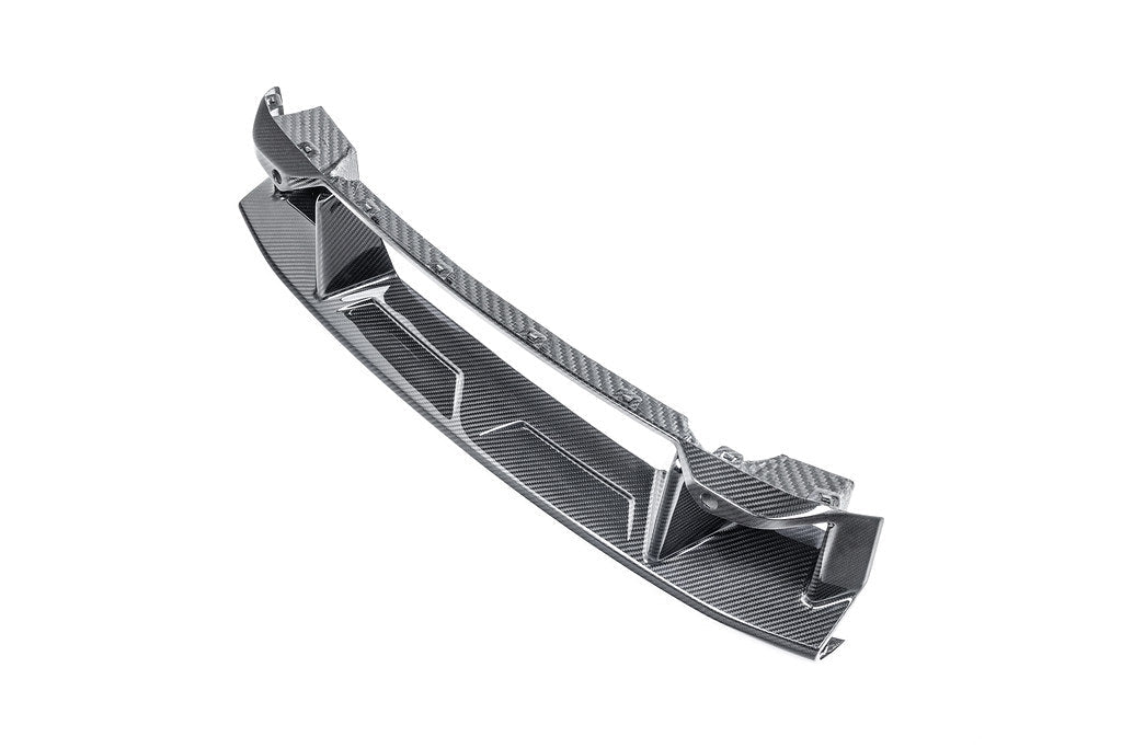 Alpha-N G87 M2 carbon front center bumper trim, exterior car part with a sleek white background.
