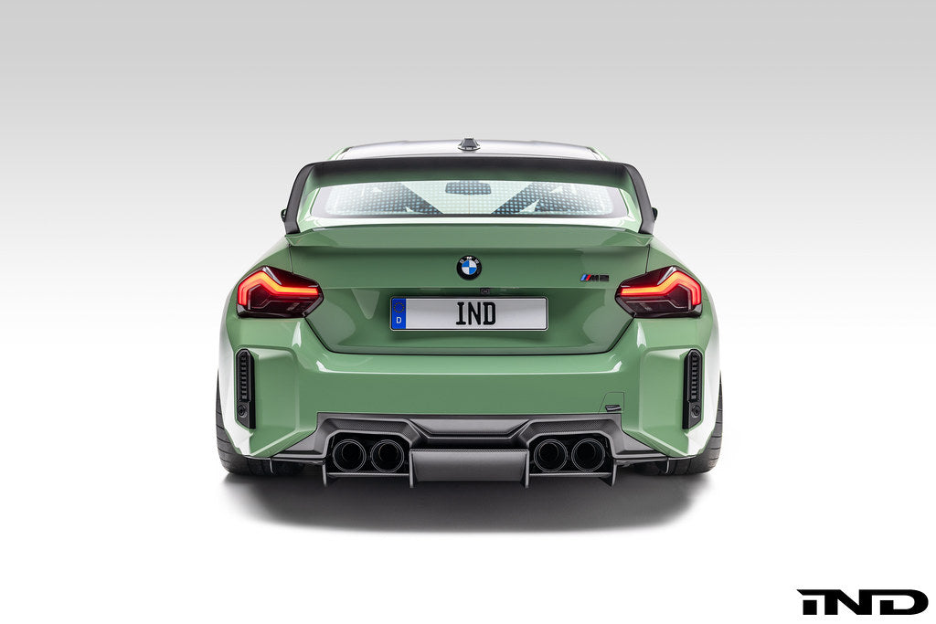 Alpha-N G87 M2 Carbon rear diffuser installed on a BMW M2 G87, showcasing its sleek aerodynamic design and carbon fiber finish.