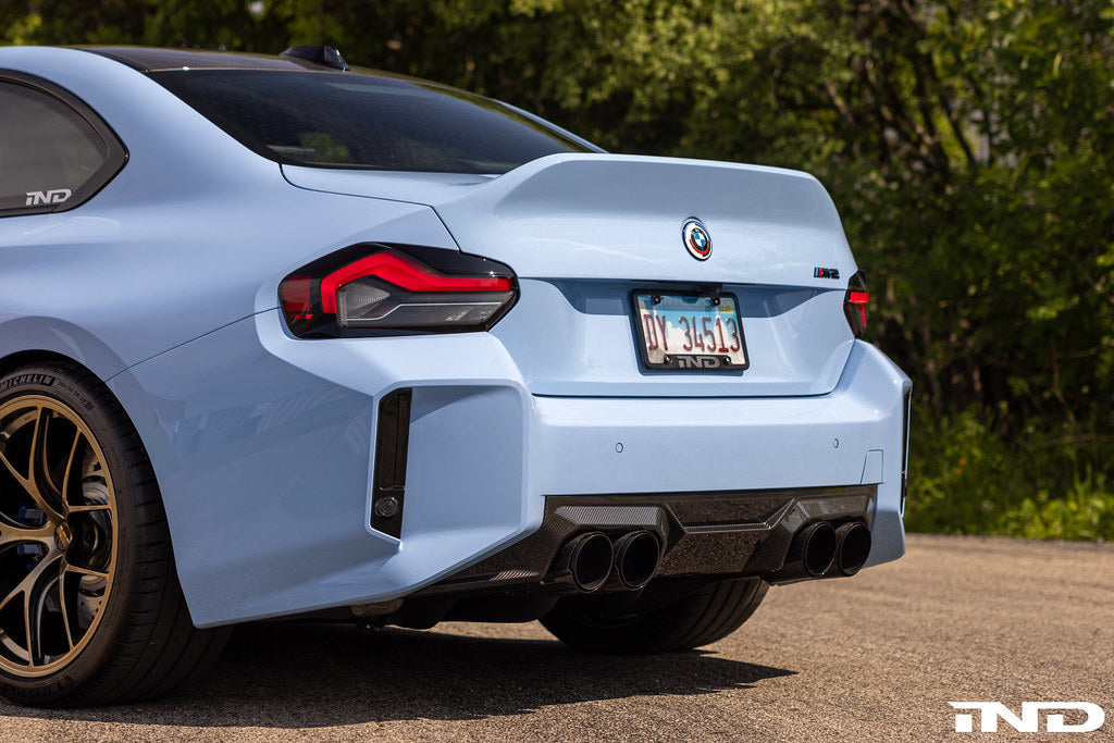 Alpha-N G87 M2 carbon rear diffuser installed on a BMW M2 G87 exterior component showing sleek black carbon fiber finish