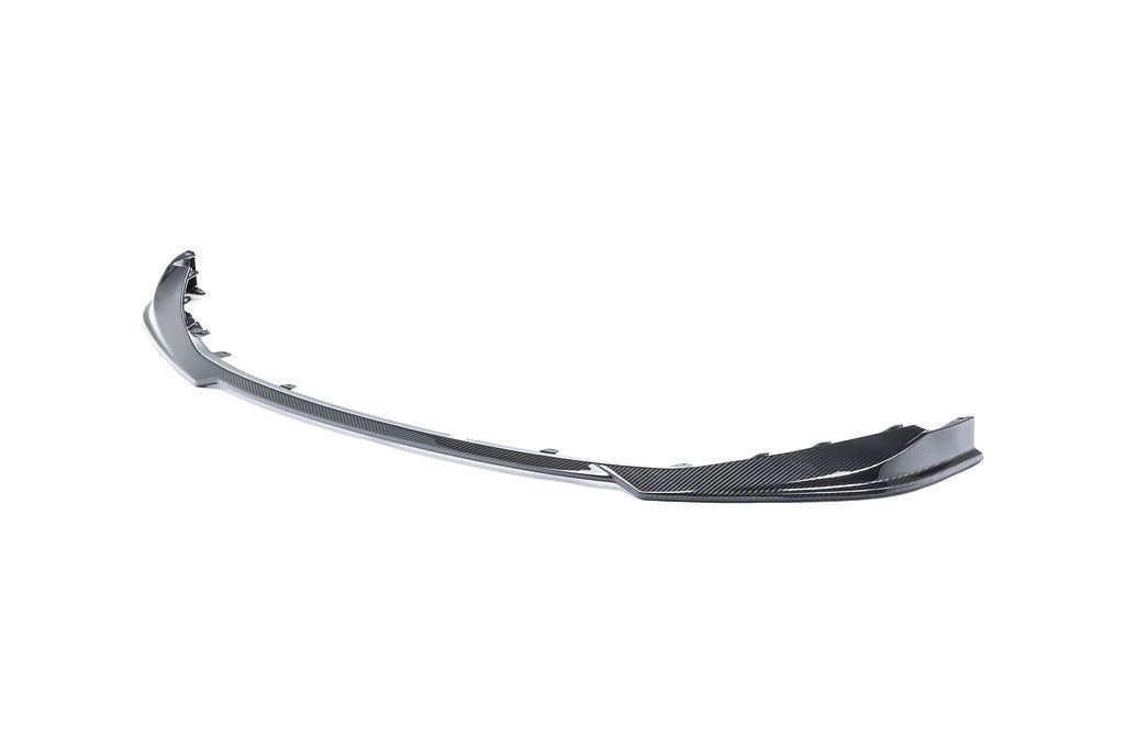 Alpha N G8X M3 M4 carbon front spoiler installed on a white background, showcasing its sleek exterior design and lightweight construction.