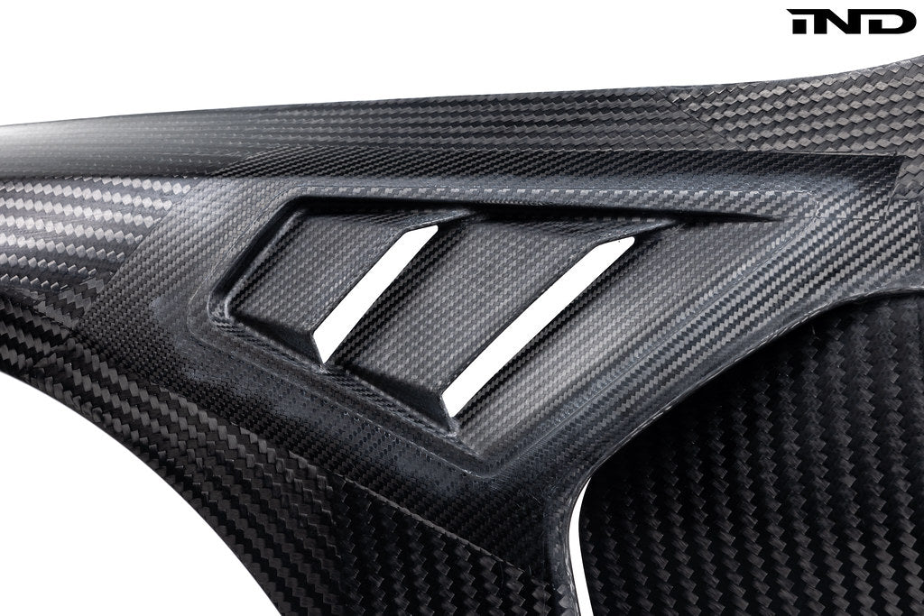 Alpha N G8X M3 M4 carbon vented front fender set for BMW, exterior automotive part with a sleek carbon finish.
