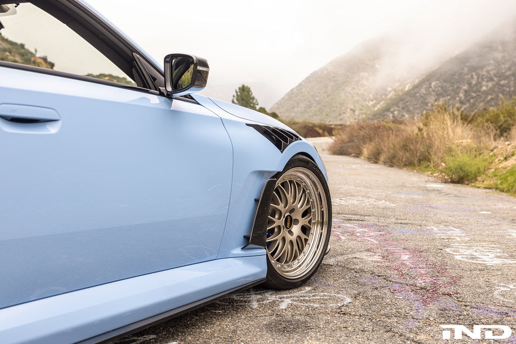 Alpha-N G87 M2 Carbon Vented Front Fender Set V4 with Blades installed on a BMW M2 exterior car.