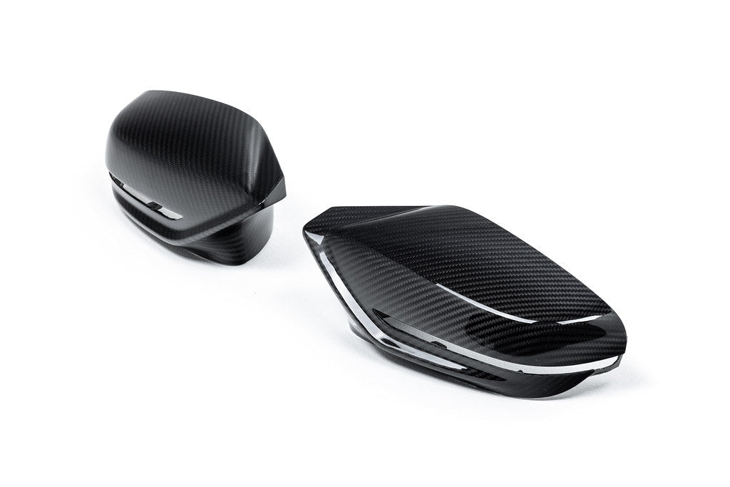 Alpha N G8X M2, M3, M4 carbon mirror cap set displayed on a white background, showcasing sleek exterior design.