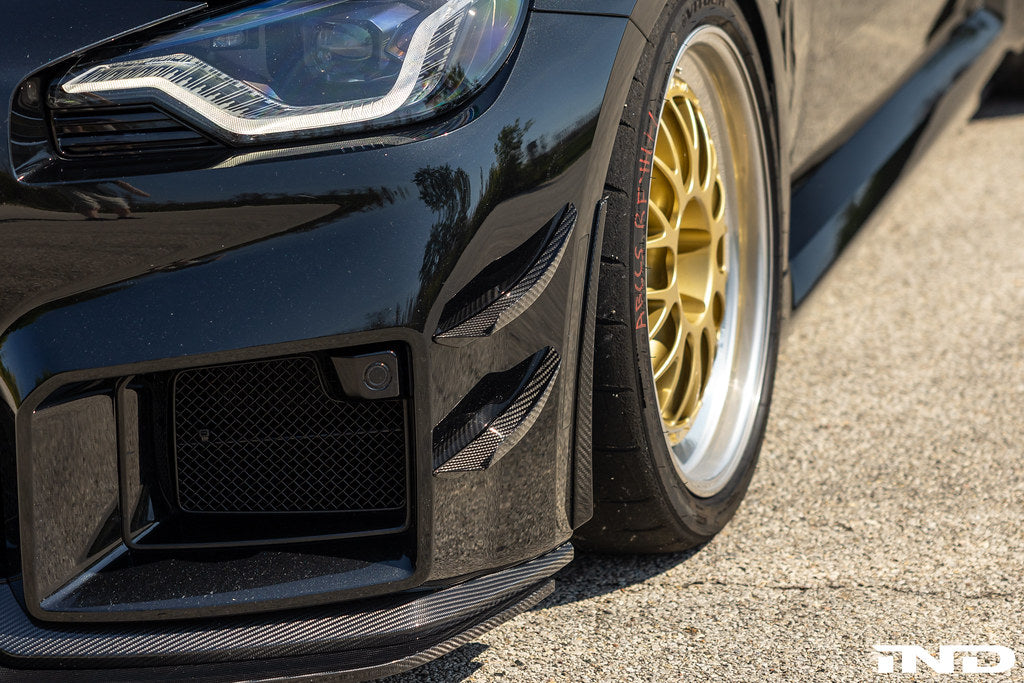 Exterior view of Alpha N G87 M2 Carbon Aeroblades showing sleek, aerodynamic carbon fiber design on a BMW M2.