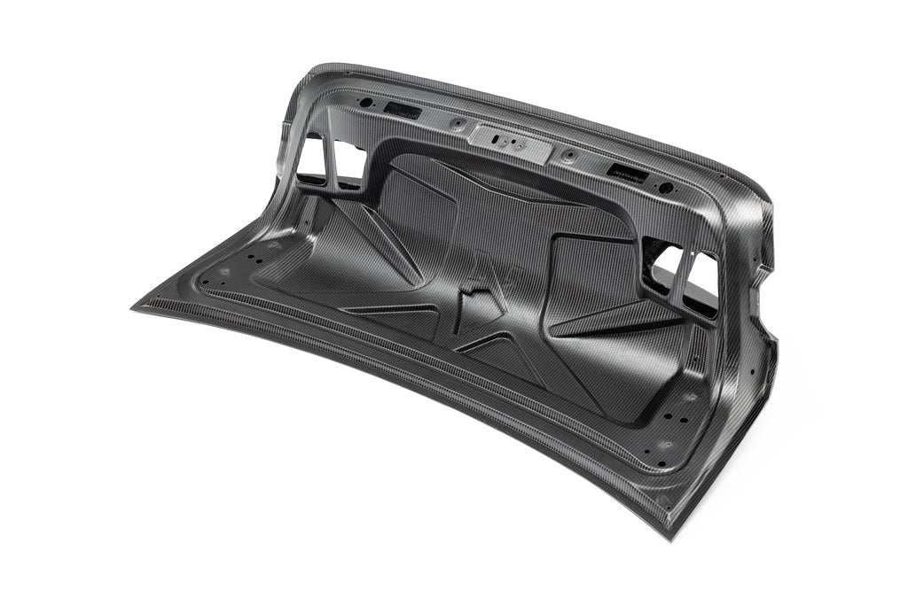 Alpha N G80 M3 Carbon CSL trunk lid installed on white background, showcasing lightweight exterior replacement for BMW M3.