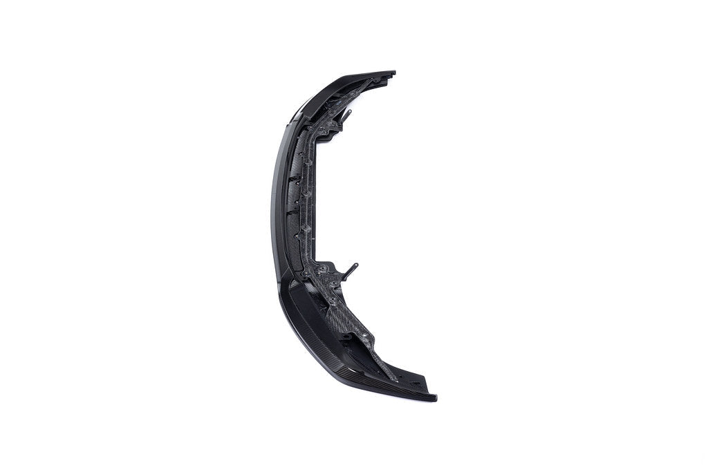 Alpha-N G87 M2 carbon adjustable front lip, Class 3, mounted on a white background, showcasing its aerodynamic design and finish.