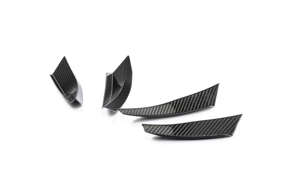 Alpha N G87 M2 carbon bumper canard set mounted on a white background, designed for aerodynamic enhancement of the vehicle's exterior.