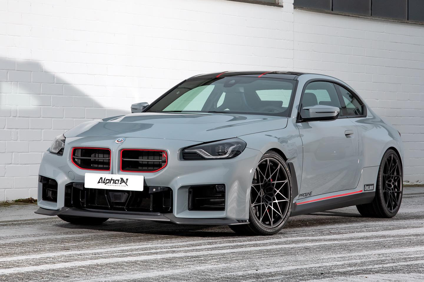 Alpha N G87 M2 Carbon Clubsport front lip installed on car, highlighting its sleek, lightweight aerodynamic design for exterior styling.