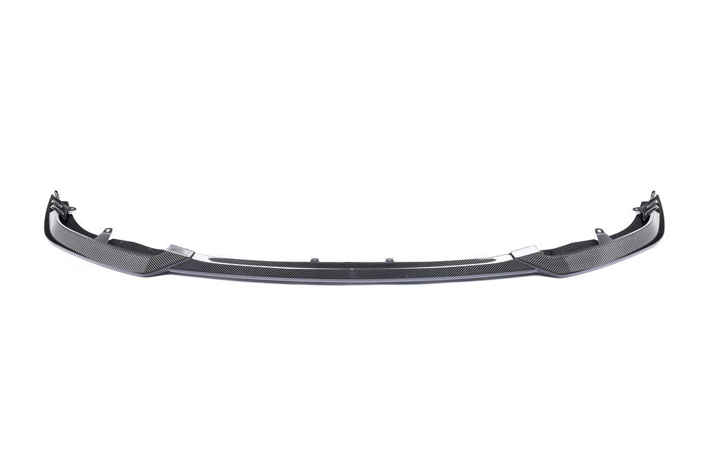 White Alpha N G87 M2 Carbon Clubsport front lip exterior car part on a plain background