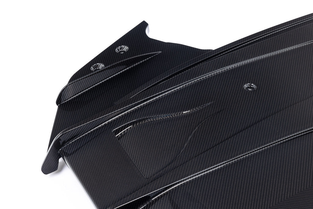 Alpha N G87 M2 carbon rear underbody floor kit shown on white background, highlighting lightweight aerodynamic design.