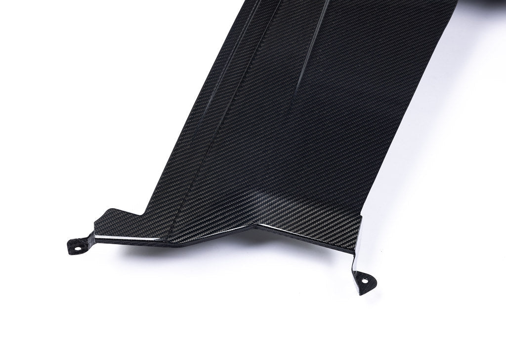 Alpha N G87 M2 carbon rear underbody floor kit installed on a car, showcasing lightweight aerodynamic design on a white background.