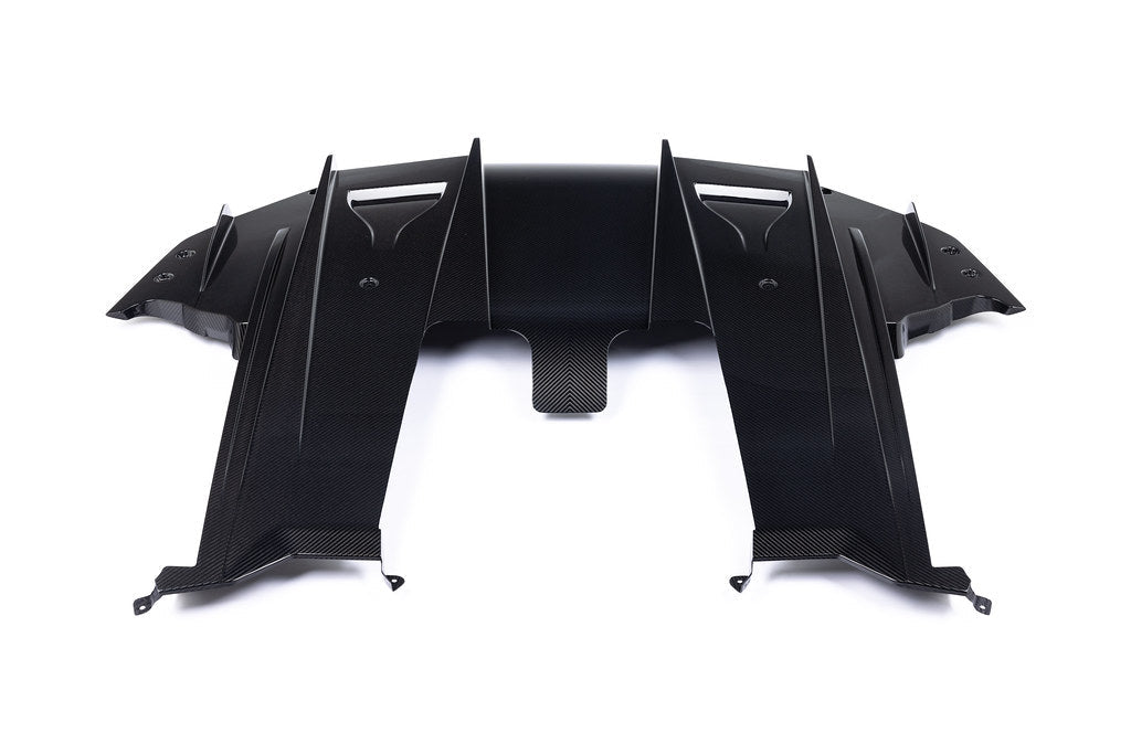 Alpha N G87 M2 Carbon rear underbody floor kit installed on a white background, showcasing sleek aerodynamic exterior upgrade.