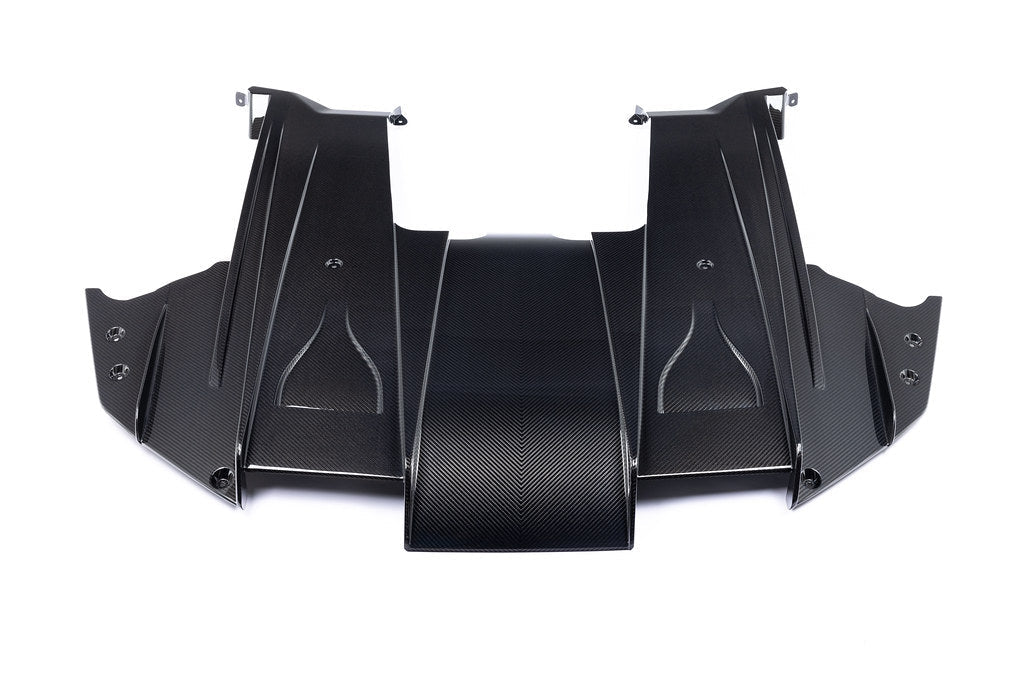 Alpha N G87 M2 carbon rear underbody floor kit installed on a white background, showcasing its lightweight aerodynamic design.