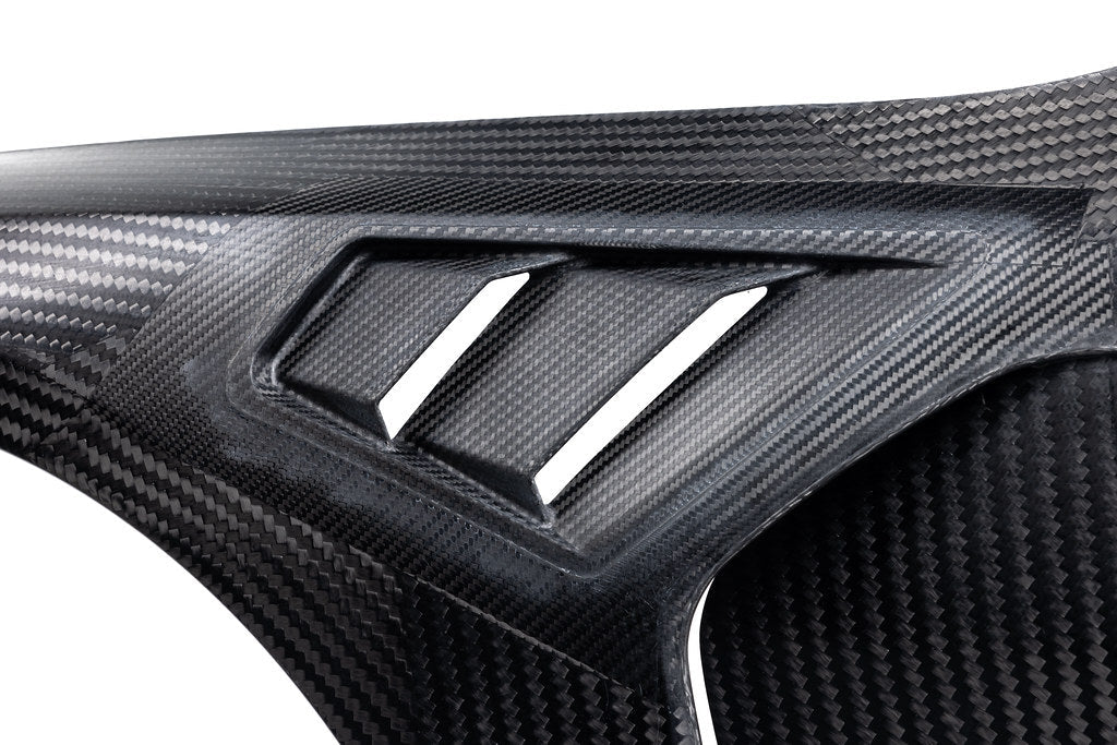 Alpha N G8X M3 M4 carbon vented front fender set for BMW, exterior automotive part with a sleek carbon finish.