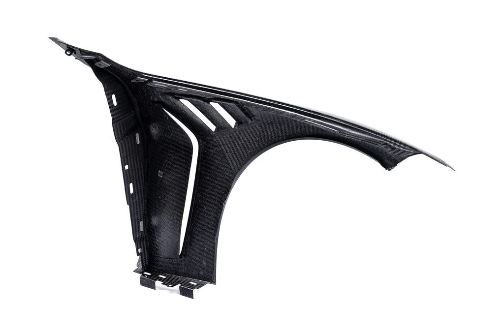 Alpha N carbon vented front fender set for BMW G8X M3 and M4 models, shown on a white background.