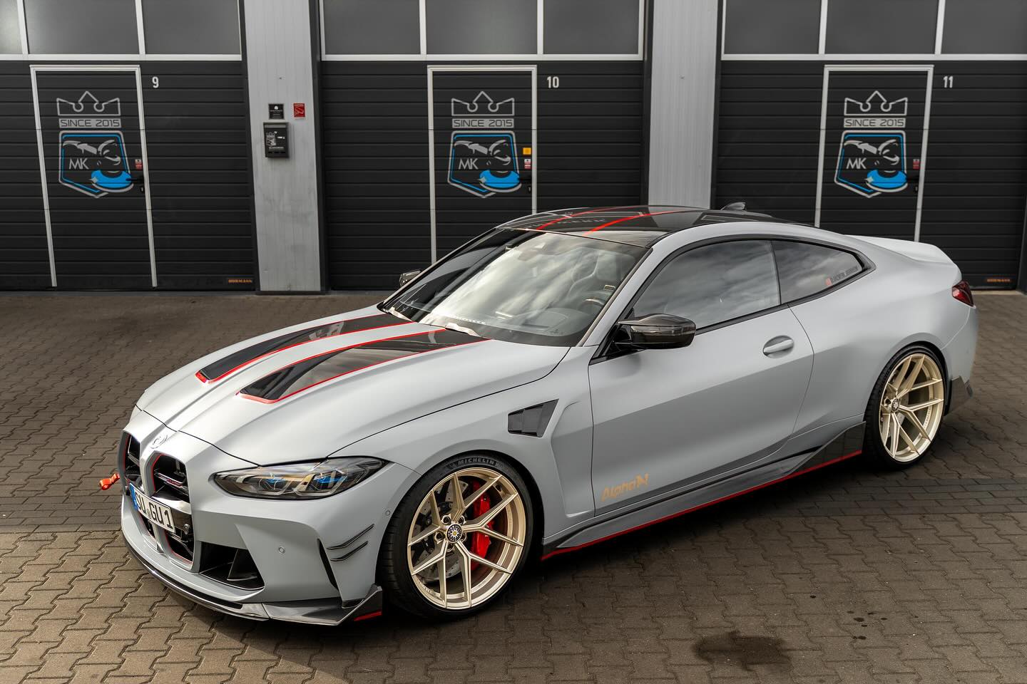 Alpha N carbon vented front fenders installed on BMW G8X M3 and M4, showcasing exterior performance enhancement and sleek design.