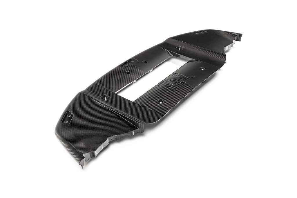 Alpha-N G87 M2 carbon Corse front splitter mounted on a vehicle, showcasing its aerodynamic design and lightweight carbon construction.