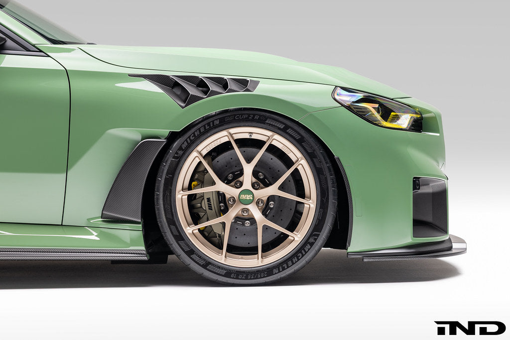 Alpha N G87 M2 Carbon Vented Front Fender Set V4 with Blades installed on a BMW M2, showcasing lightweight carbon exterior fenders.