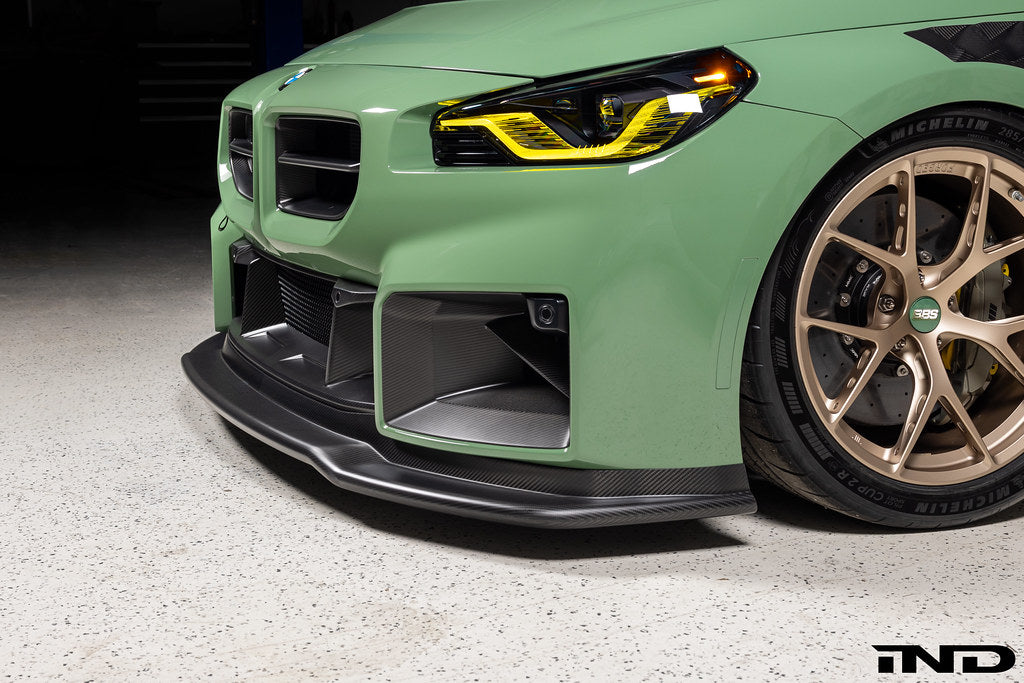 Alpha-N G87 M2 Carbon Corse front splitter, matte clear exterior car part installed on a BMW M2.