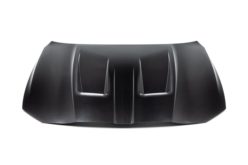 Alpha N G8X M3 M4 carbon fiber vented hood in raw finish, showing its lightweight, aerodynamic exterior design.