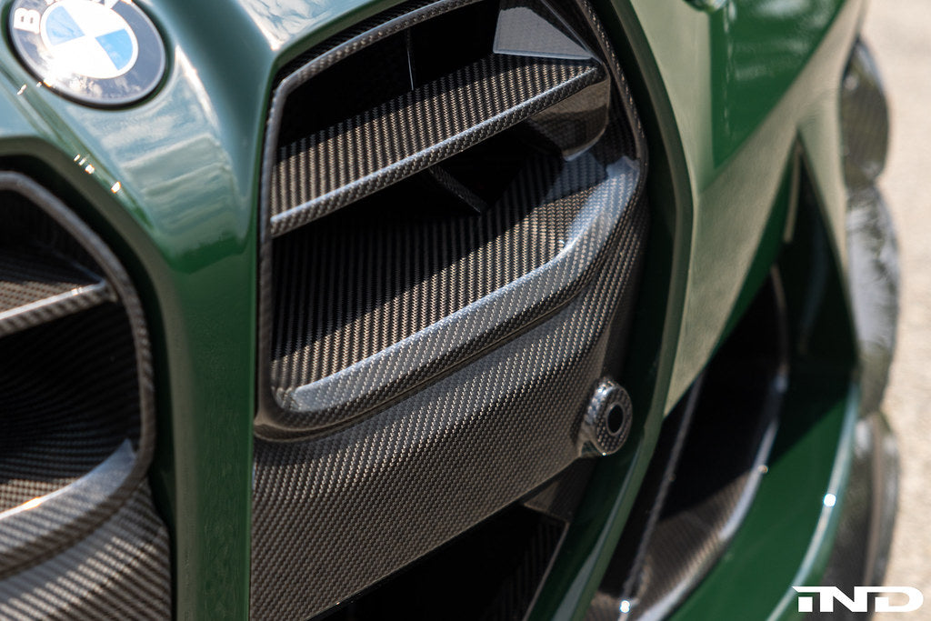 Alpha N G8X M3 M4 carbon front grille installed on a vehicle, showcasing the sleek, lightweight exterior upgrade.