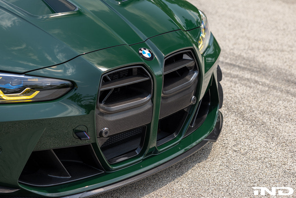 Alpha N G8X M3 M4 carbon front grille installed on the vehicle, showcasing its sleek, aerodynamic exterior design.