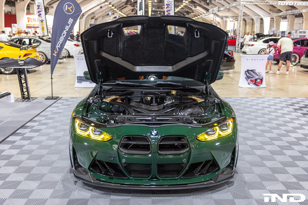 Alpha N G8X M3 M4 carbon front grille installed on exterior of car, showcasing custom paint and sleek design.